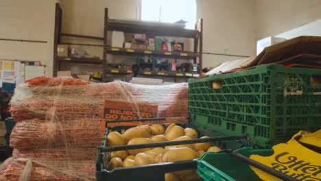 Interior-Of-UK-Food-Bank-Building-With-Fresh-Food-Being-Sorted-For-Delivery-3
