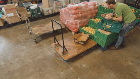 Interior-Of-UK-Food-Bank-Building-With-Fresh-Food-Being-Sorted-For-Delivery-10