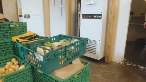 Interior-Of-UK-Food-Bank-Building-With-Fresh-Food-Being-Sorted-For-Delivery-11