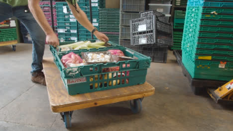 Interior-Of-UK-Food-Bank-Building-With-Fresh-Food-Being-Sorted-For-Delivery-15