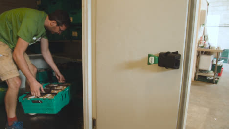 Interior-Of-UK-Food-Bank-Building-With-Fresh-Food-Being-Sorted-For-Delivery-18