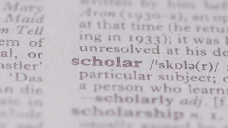 Close-Up-On-Page-Of-Dictionary-With-Definition-Of-Word-Scholar