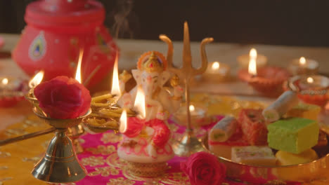 Person-Holding-Five-Wick-Lamp-With-Decorations-Celebrating-Festival-Of-Diwali-1