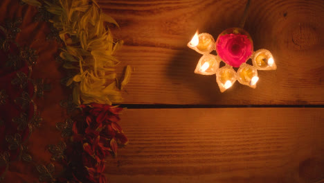 Still-Life-Of-Five-Wick-Lamp-On-Table-With-Green-Screen-Digital-Tablet-In-Festival-Of-Diwali