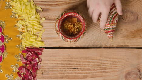 Overhead-Of-Traditional-Coconut-Pots-On-Table-Decorated-For-Celebrating-Festival-Of-Diwali-1