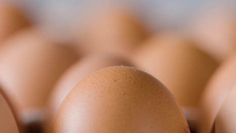 Close-Up-Studio-Shot-Of-Brown-Eggs-In-Cardboard-Tray-1