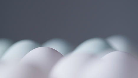 Close-Up-Studio-Shot-Of-White-Eggs-In-Cardboard-Tray