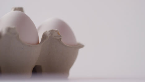 Studio-Shot-Of-Open-Box-Of-White-Eggs-On-Marble-Work-Surface-Background-2