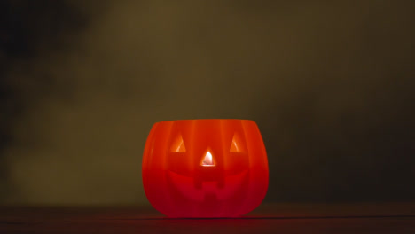 Halloween-Pumpkin-Jack-O-Lantern-With-Candle-Made-From-Carved-Out-Pumpkin-With-Smoke