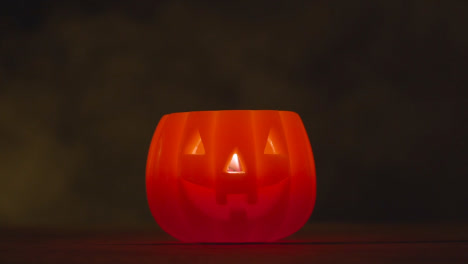 Halloween-Pumpkin-Jack-O-Lantern-With-Candle-Made-From-Carved-Out-Pumpkin-With-Smoke-1