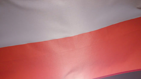 Close-Up-Studio-Shot-Of-Polish-Flag-Flying-Filling-Frame