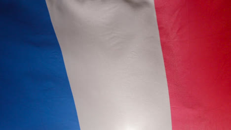 Close-Up-Studio-Shot-Of-French-Flag-Flying-Filling-Frame
