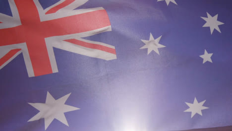Close-Up-Studio-Shot-Of-Australia-Flag-Flying-Filling-Frame