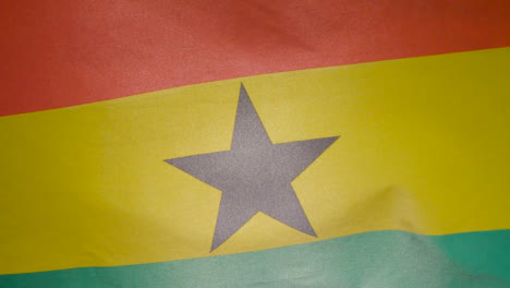 Close-Up-Studio-Shot-Of-Ghanaian-Flag-Flying-Filling-Frame