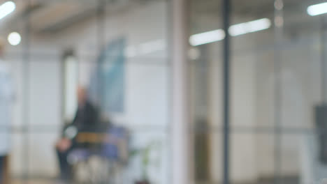 Defocused-Background-Shot-Of-Anxious-Patient-Waiting-In-Hospital-For-Appointment-1