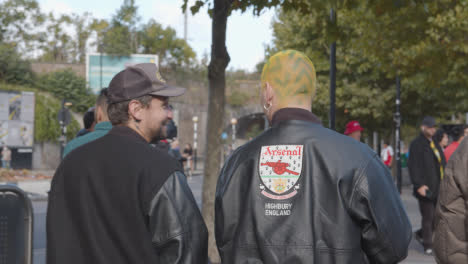 Fan-With-Dyed-Hair-Outside-The-Emirates-Stadium-Home-Ground-Arsenal-Football-Club-London-With-Supporters-On-Match-Day