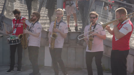 Band-Playing-Outside-The-Emirates-Stadium-Home-Ground-Arsenal-Football-Club-London-With-Supporters-On-Match-Day-1