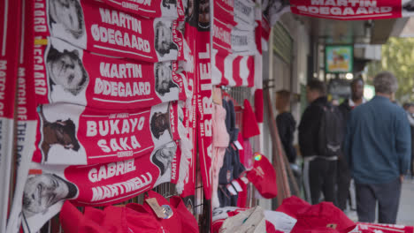 Stall-Selling-Club-Merchandise-Outside-The-Emirates-Stadium-Home-Ground-Arsenal-Football-Club-London-With-Supporters-On-Match-Day-1