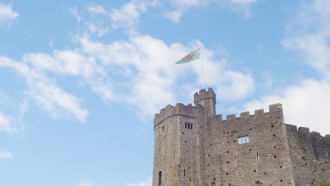 Welsh-Flag-Flying-From-Cardiff-Castle-Against-Blue-Sky