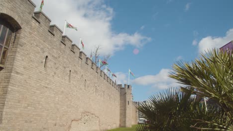 Welsh-Flags-Flying-From-Cardiff-Castle-Against-Blue-Sky