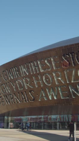 Vertical-Video-Showing-Exterior-Of-Millennium-Centre-In-Cardiff-Wales-With-Modern-Architecture