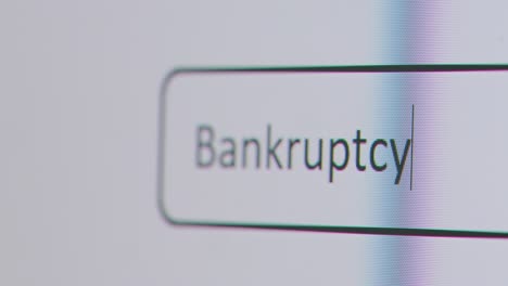 Close-Up-Of-Screen-With-Person-Typing-Bankruptcy-Into-Computer-Search-Engine