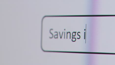 Close-Up-Of-Screen-With-Person-Typing-Savings-Interest-Rates-Into-Computer-Search-Engine