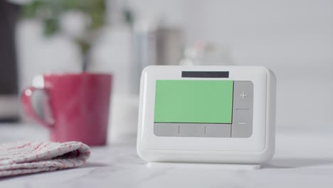 Hot-Drink-In-Kitchen-At-Home-With-Green-Screen-Smart-Meter-In-Foreground