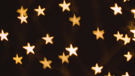 Hintergrund-Der-Weihnachtsbeleuchtung-In-Form-Von-Sternen