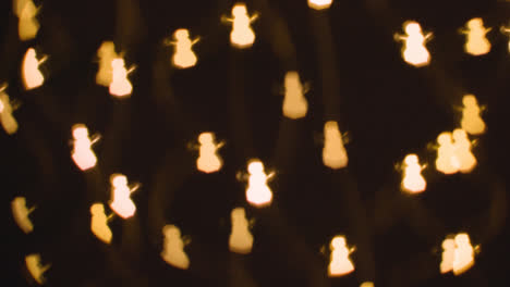 Background-Of-Christmas-Lights-In-The-Shape-Of-Snowmen