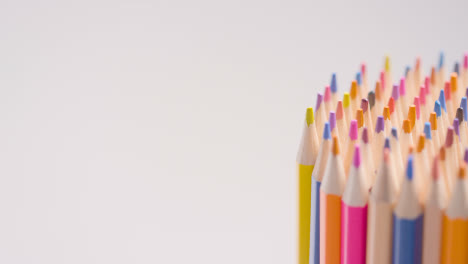 Studio-Shot-Of-Rotating-Multi-Coloured-Pencils-Against-White-Background-6