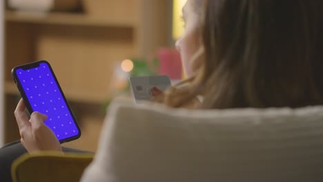 Close-Up-Of-Woman-At-Home-Shopping-Online-With-Credit-Card-Using-green-screen,-blue-Screen-Mobile-Phone-3