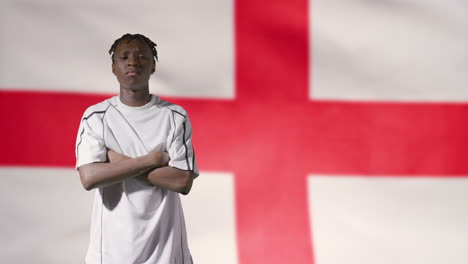 Young-Footballer-Walking-to-Camera-In-Front-of-England-Flag-02