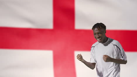 Young-Footballer-Celebrating-to-Camera-In-Front-of-England-Flag-02