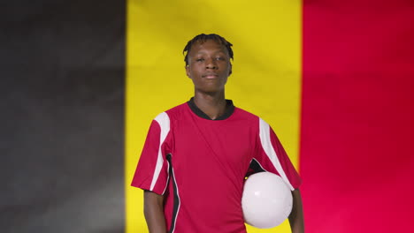 Young-Footballer-Posing-In-Front-of-Belgium-Flag-01