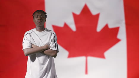 Young-Footballer-Posing-In-Front-of-Canada-Flag-02