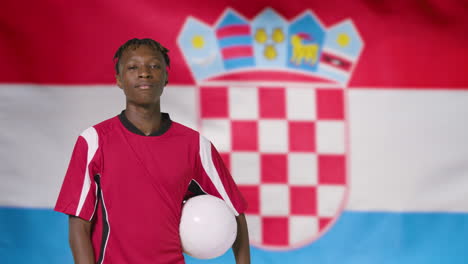Young-Footballer-Posing-In-Front-of-Croatia-Flag-01