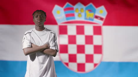 Young-Footballer-Posing-In-Front-of-Croatia-Flag-02