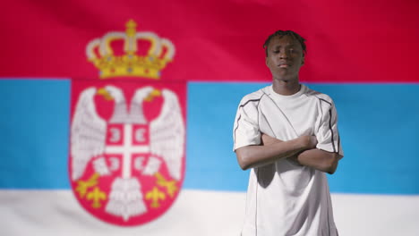 Young-Footballer-Posing-In-Front-of-Serbia-Flag-02