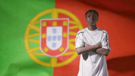 Young-Footballer-Posing-In-Front-of-Portugal-Flag-02