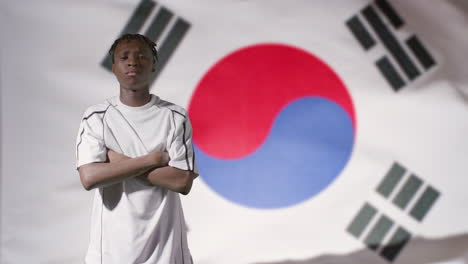 Young-Footballer-Posing-In-Front-of-South-Korea-Flag-02