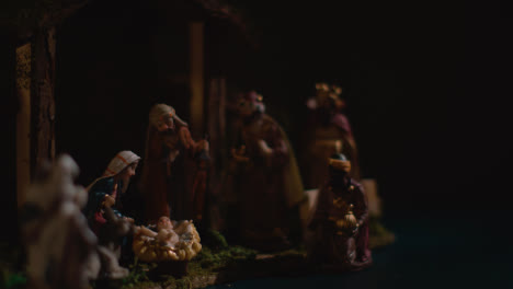 Studio-Christmas-Concept-Of-Baby-Jesus-In-Manger-With-Figures-From-Nativity-Scene-3