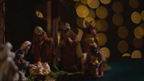 Studio-Christmas-Concept-Of-Baby-Jesus-In-Manger-With-Figures-From-Nativity-Scene-With-Lights-1