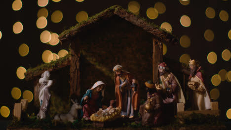 Studio-Christmas-Concept-Of-Baby-Jesus-In-Manger-With-Figures-From-Nativity-Scene-With-Lights-2