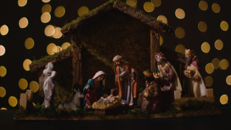 Studio-Christmas-Concept-Of-Baby-Jesus-In-Manger-With-Figures-From-Nativity-Scene-With-Lights-3