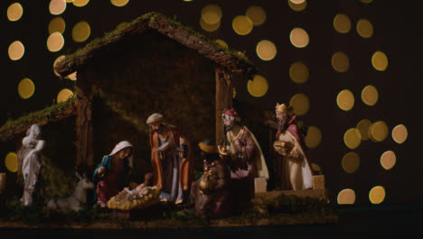 Studio-Christmas-Concept-Of-Baby-Jesus-In-Manger-With-Figures-From-Nativity-Scene-With-Lights-4