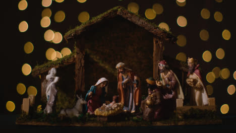 Studio-Christmas-Concept-Of-Baby-Jesus-In-Manger-With-Figures-From-Nativity-Scene-With-Lights-5