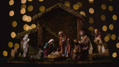 Studio-Christmas-Concept-Of-Baby-Jesus-In-Manger-With-Figures-From-Nativity-Scene-With-Lights-6