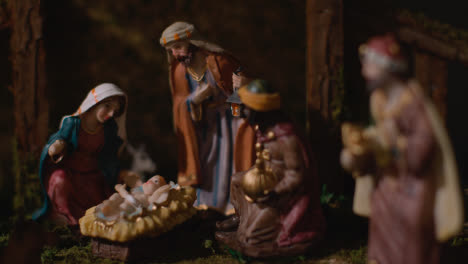 Studio-Christmas-Concept-Of-Baby-Jesus-In-Manger-With-Figures-From-Nativity-Scene-4