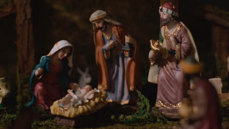 Studio-Christmas-Concept-Of-Baby-Jesus-In-Manger-With-Figures-From-Nativity-Scene-6